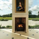 stone fireplace with landscape views in the background