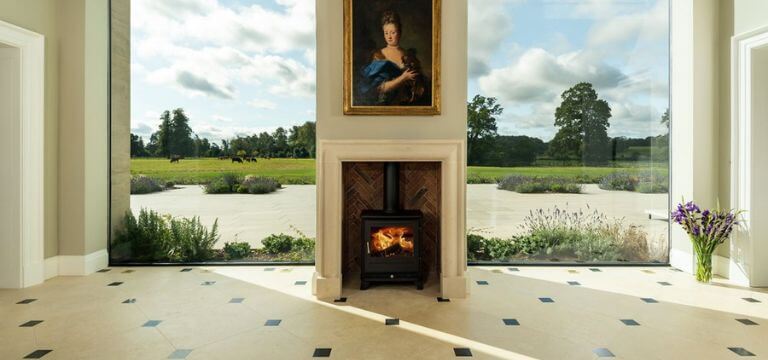 stone fireplace with landscape views in the background